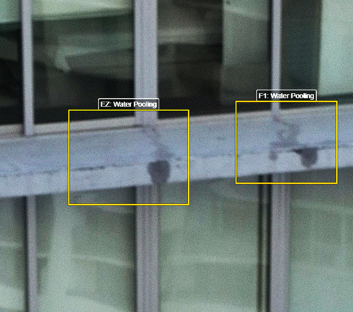 Automated defect detection highlighting cracks on a concrete building surface